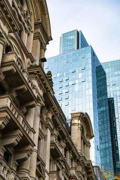 istock Facade of old building on background of skyscraper 1230195448