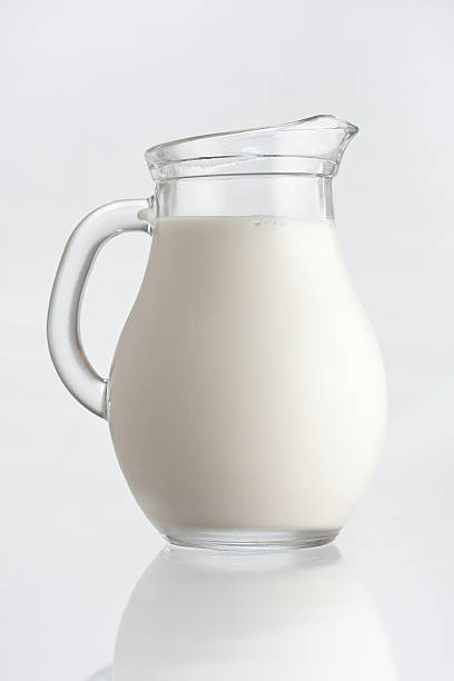 istock Jar full of fresh milk in white background 123019900