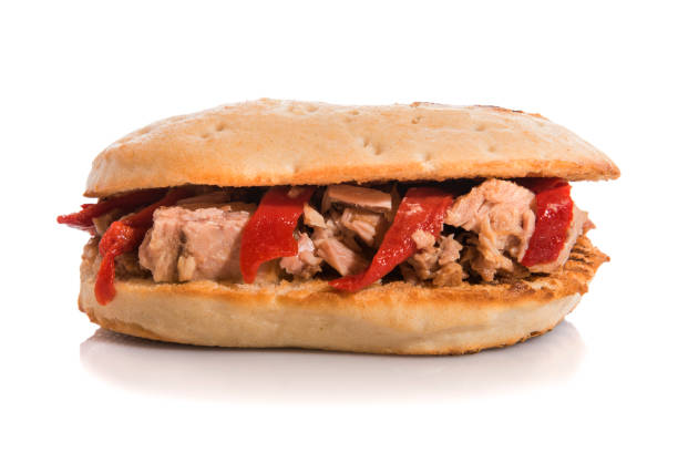 istock Tuna sandwich with red peppers isolated on white. 1230204061