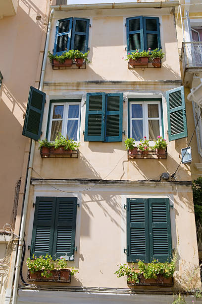 Mediterranean architecture abstract windows and shutters - Kerkira town - Corfu island - Greece corfu town stock pictures, royalty-free photos & images