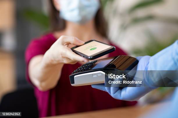 Contactless Smartphone Payment Stock Photo - Download Image Now - Paying, Contactless Payment, Coronavirus
