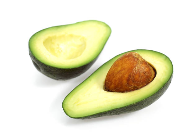 istock AVOCADO persea gratissima AGAINST WHITE BACKGROUND 1230451898