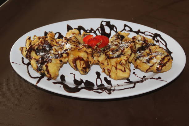 istock Fried bananas with chocolate sauce 1230476447