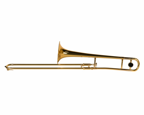 Ancient weathered brass trumpet isolated on a white background