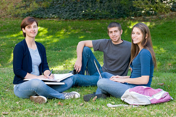 istock Three Teenage Students Sitting and Posing for the Camera 123050792