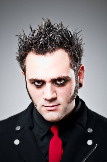 Emo Goth Portrait Young man with a dark and serious look about him.  emo hair guys stock pictures, royalty-free photos & images