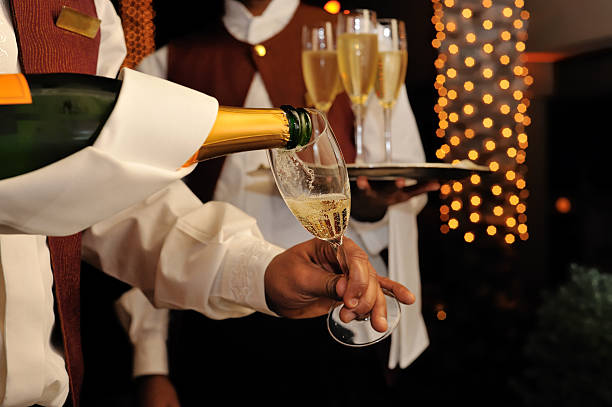 champagne pouring stock photo
