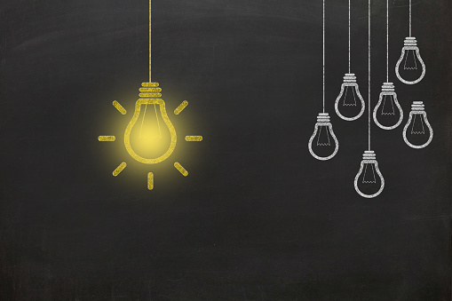 Different creative idea light bulb leadership brainstorming