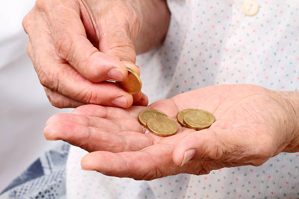 istock Old woman with coins 123055298