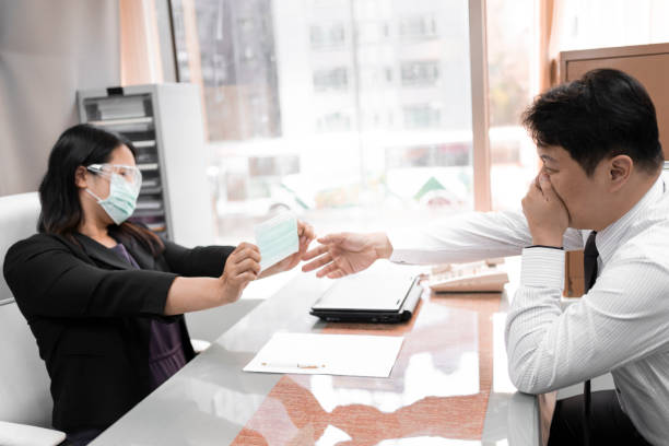 istock Anti-epidemic cooperation in the office 1230583987