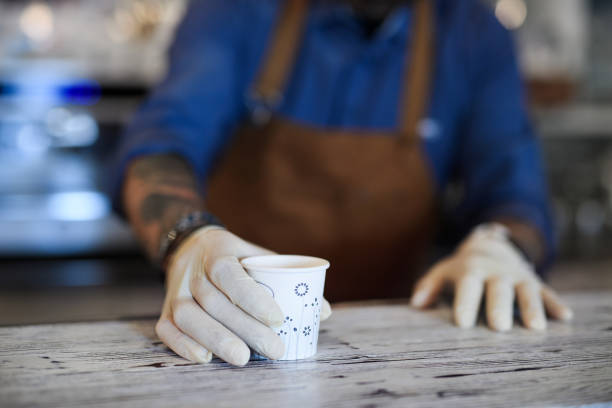 istock Barista working with gloves, coffee shop open after lockdown quarantine. 1230614337