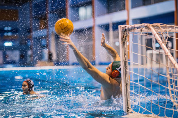 istock Two young men playing a water polo 1230737018