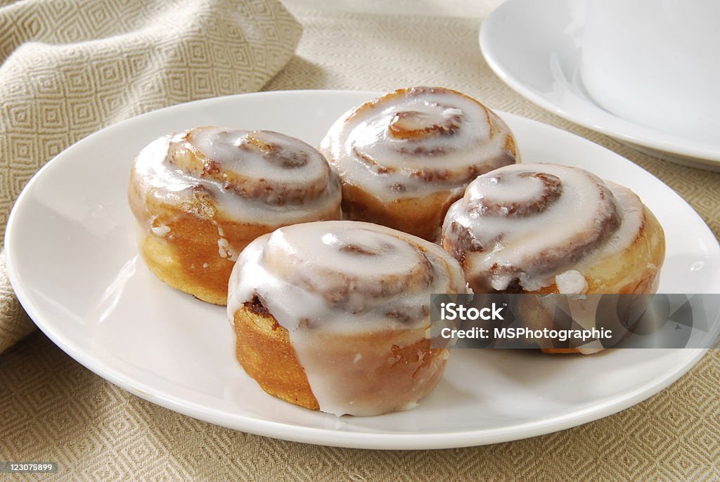 Mini cinnamon rolls A close up photo of a plate of cinnamon rolls Cinnamon Bun Stock Photo