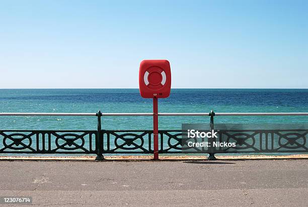 Lifejacket On Seafront Promenade Brighton Uk Stock Photo - Download Image Now - Brighton - England, Asphalt, Bay of Water