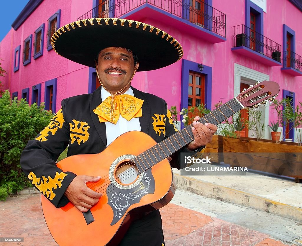 Charro Mariachi playing guitar Mexico houses  Mexico Stock Photo