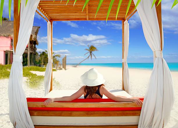 istock gazebo tropical beach woman rear view looking sea 123078251