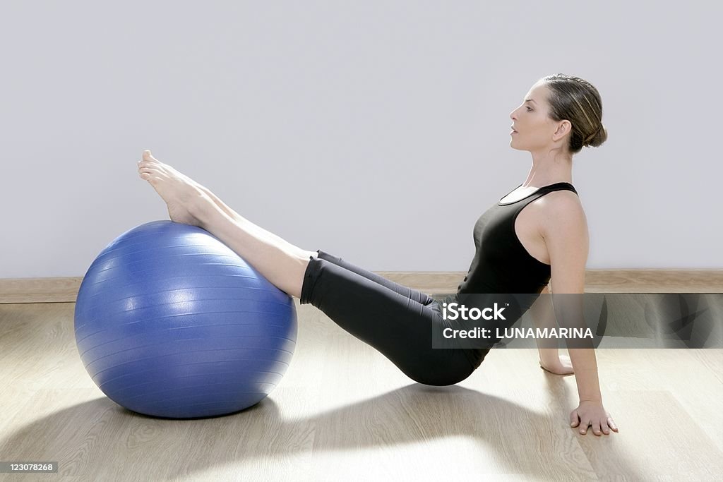 pilates woman stability ball gym fitness yoga  30-34 Years Stock Photo