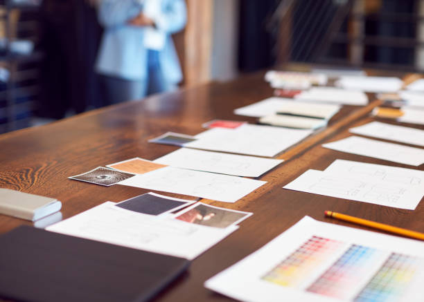 istock Drawings And Swatches Laid Out On Table For Creative Team Meeting 1230792966