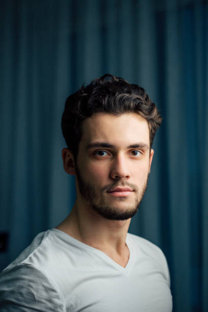 istock young bearded man in white shirt 1230804020