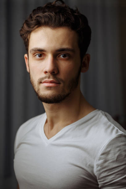 istock young bearded man in white shirt 1230804546