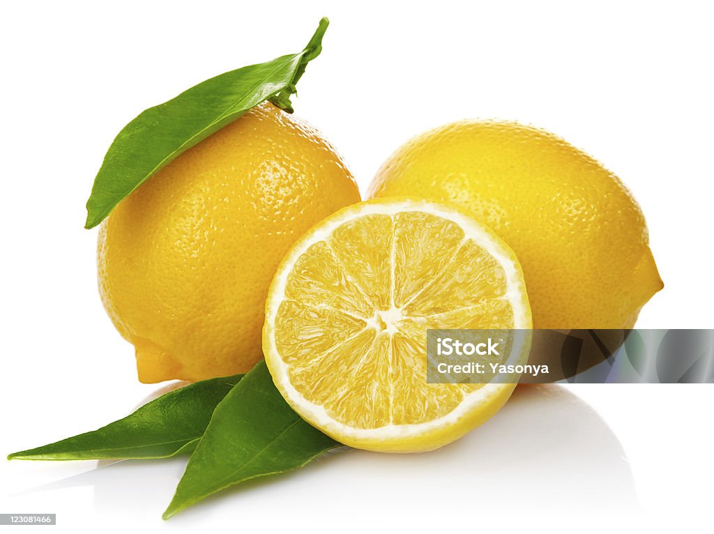 fresh lemons with cut and green leaves fresh lemons with cut and green leaves isolated on white background Citrus Fruit Stock Photo