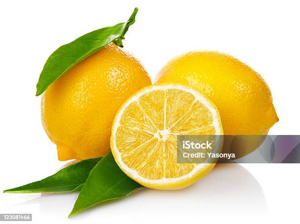 Fresh Lemons With Cut And Green Leaves Stock Photo - Download Image Now - Citrus Fruit, Color Image, Cross Section