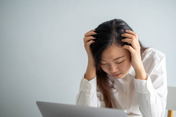 istock Young asian woman stress at work 1230834485