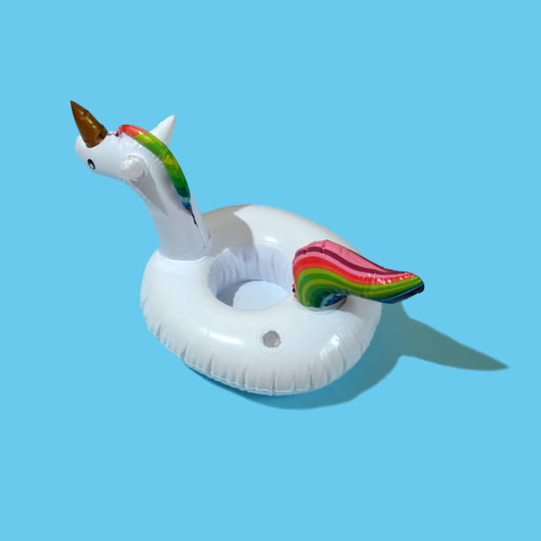 istock Inflatable unicorn pool toy on blue background. Minimal summer concept. 1230846807