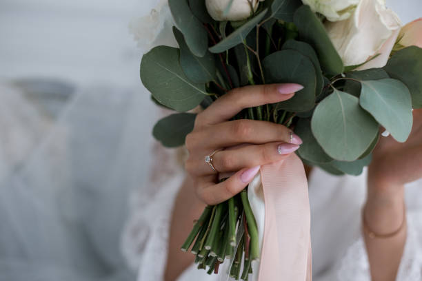 istock bride in a wedding dress with a bouquet 1230870394
