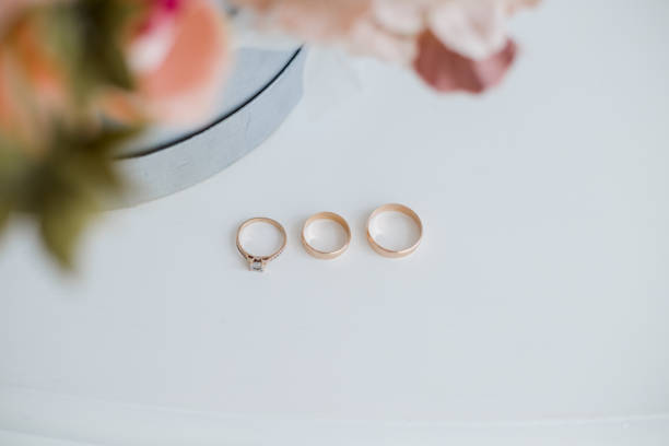 istock wedding gold rings on the table 1230873945