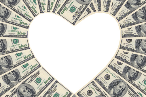 Hundred Dollar Bills Forming A Heart Shape On A White Background