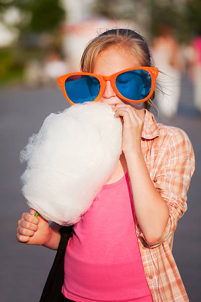istock Girl eating cotton candy 123088970