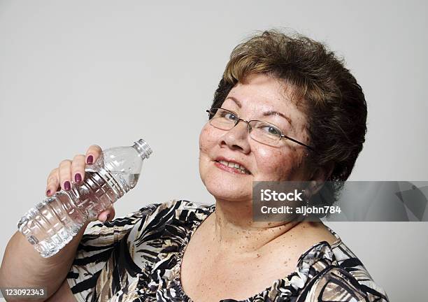 Drink Up Stock Photo - Download Image Now - Overweight, Women, 55-59 Years