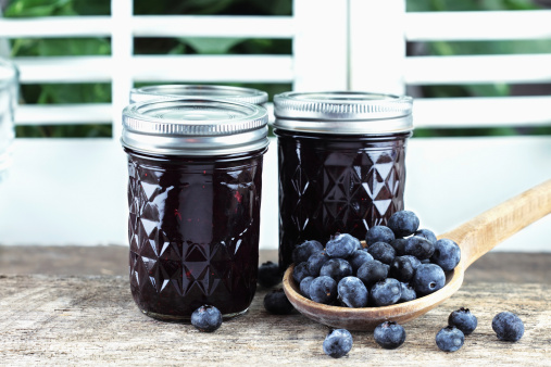 Homemade blueberry jam or preserves with fresh blueberries.