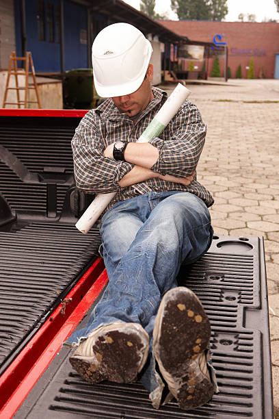 Sleeping engineer Sleeping engineer lazy construction laborer stock pictures, royalty-free photos & images