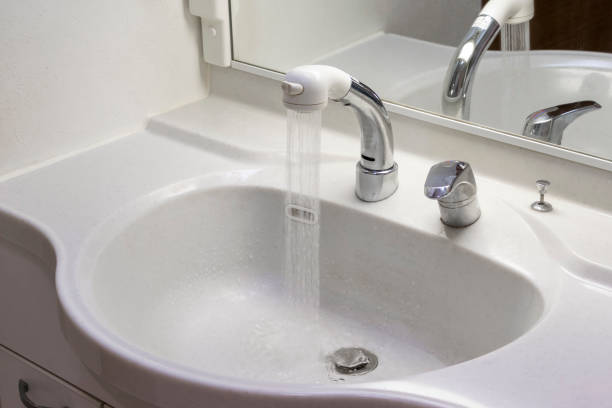 istock White washstand with shower head 1231012606