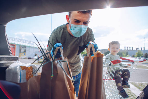istock Father and son shopping during pandemic 1231050033