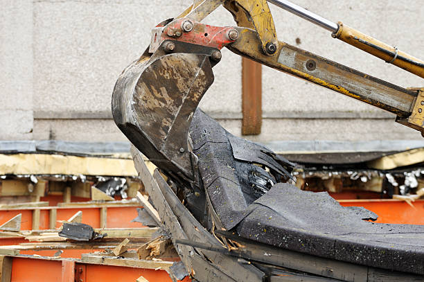 istock Hydraulic digger being used to demolish a school building 123107509