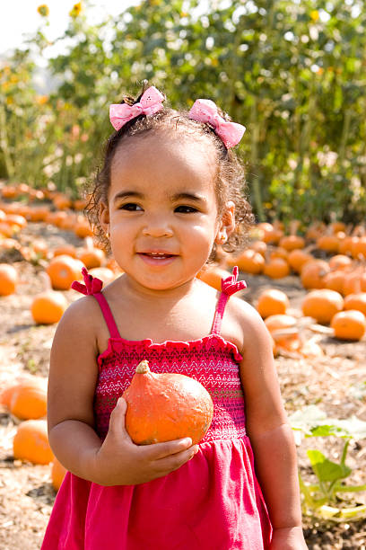 istock Girl in the pumpkin patch 123107543
