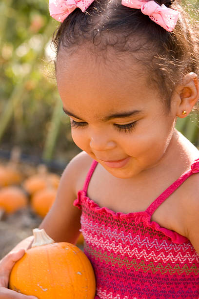 istock Little girl in the pumpkin patch 123107549