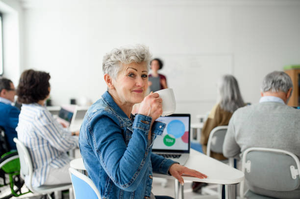 Portrait of senior attending computer and technology education class.