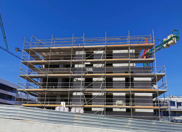 istock house building construction with scaffolding and cranes 1231130030