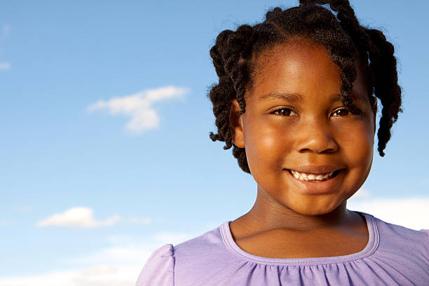 istock Little girl and blue skies 123113101