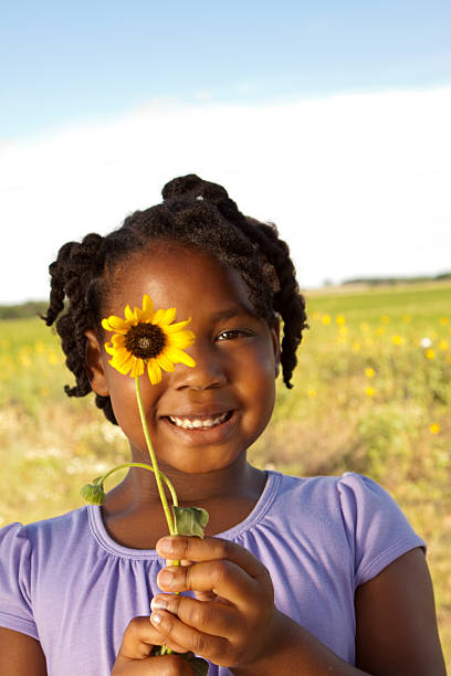 istock Little girl holding a flower 123113268