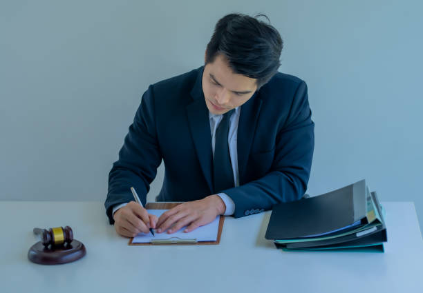 istock Young Asian handsome man in a posing office suit. 1231139846