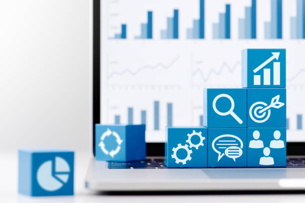 istock Marketing strategy and business data. Blue blocks and laptop. 1231167604