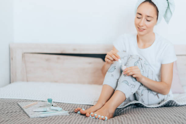 istock Girl makes a pedicure at home. 1231181422