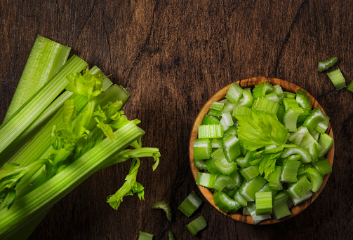 Vegetable greens on black background plate