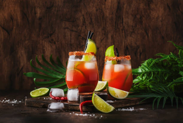 Michelada - Mexican inspired bloody mary alcoholic cocktail with beer, lime juice, tomato juice, spicy sauce and spices, copy space Michelada - Mexican inspired bloody mary alcoholic cocktail with beer, lime juice, tomato juice, spicy sauce and spices, copy space bloody mary stock pictures, royalty-free photos & images