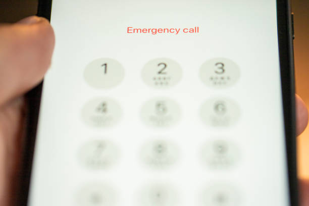 Astrakhan, Russia - October 26, 2018: Close-up view of dialing emergency call using a iPhone Selected focus